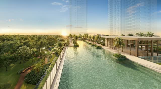 Vista aérea da piscina de 60 m ao lado do edifício de lazer, com as torres ao fundo